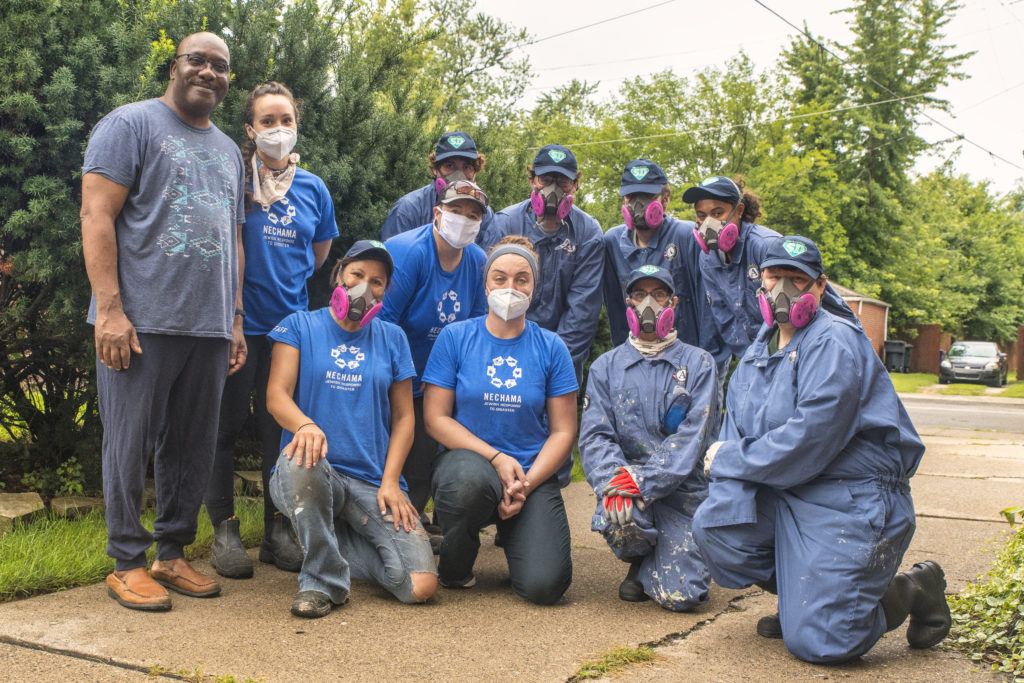 Michigan Program Extended- Nechama and AmericorpNCCC team members pose for a photo with a homeowner