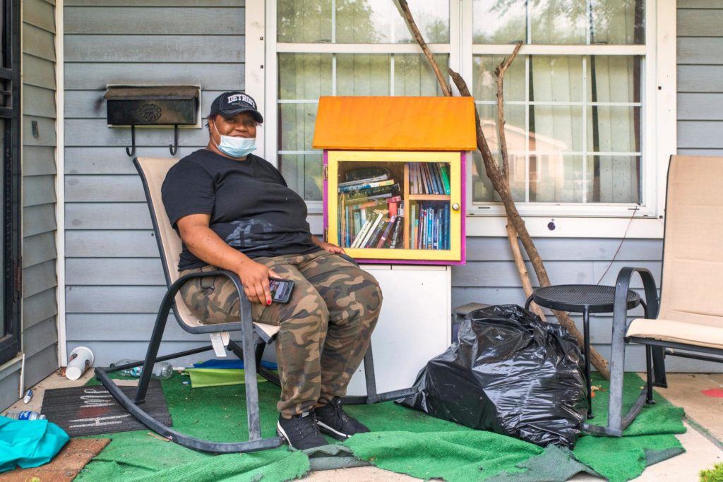 Giving back to those who Give. A homeowner sits on their porch after their home has been cleared of damaged materials following flooding in Detroit, Michigan.